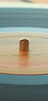 Close-up of a spinning vinyl record in soft lighting.