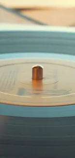 Orange vinyl record spinning on a turntable, perfect for a retro wallpaper.