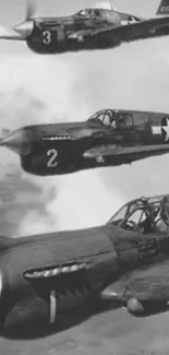 Three vintage fighters in aerial display.