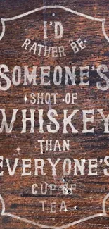 Rustic vintage whiskey quote on wooden background wallpaper.