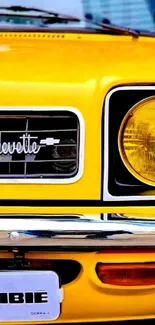 Vintage yellow car front view, close-up of headlight.