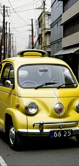 Vintage yellow car on an urban street, perfect for mobile wallpaper.