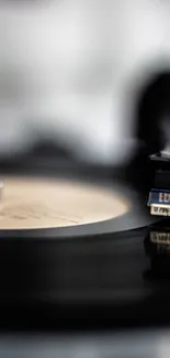 Close-up of a vinyl record player spinning.