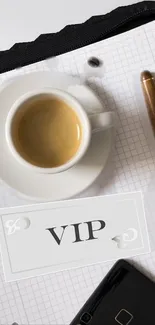 Stylish desk wallpaper with coffee, pen, VIP card, and notebook.