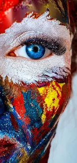 A vibrant mobile wallpaper with colorful face paint and a striking blue eye.