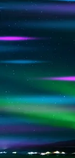 Vibrant aurora borealis under a starry night sky in vivid colors.