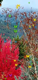 Beautiful autumn mountainscape with red foliage and snowy peaks.