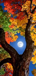 Colorful tree with full moon in night sky.