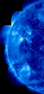 Vivid blue solar flare image with detailed sun surface.