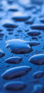 Close-up of vivid blue water droplets on a smooth surface.