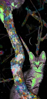 Two glowing cats sitting on colorful trees at night.