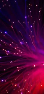 Vibrant red and purple fiber optic light display on mobile wallpaper.