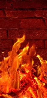 Mobile wallpaper of bright, vivid flames against a rustic brick wall.