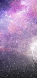 Vibrant galaxy wallpaper with purple hues and starry details.