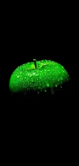 A vibrant green apple on a dark background wallpaper.