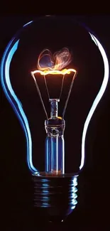 Glowing light bulb with brilliant blue and orange hues on a dark background.