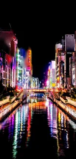 Neon-lit cityscape reflecting on a calm river at night.