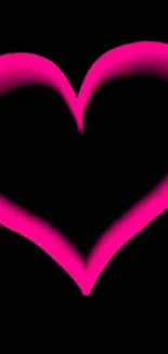 Glowing pink heart design on black background wallpaper.