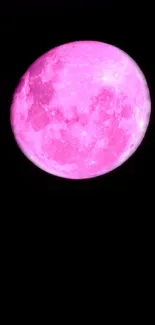 Vivid pink moon against a dark sky background.