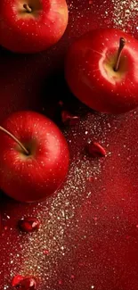 Vibrant red apples on a textured background.