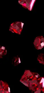Vivid red gemstones cascading on black background
