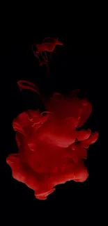 Abstract red ink splash on black background mobile wallpaper.