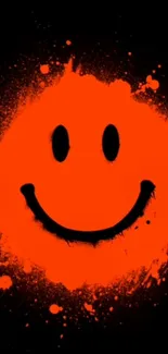 Vibrant orange smiley face on black background.