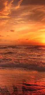 A vivid sunset over a tranquil beach, casting orange hues across ocean waves.