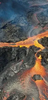 Flowing volcanic lava across rugged rocks, creating a fiery landscape.