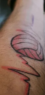 Volleyball tattoo on a forearm, artistic design.