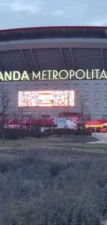 Night view of Wanda Metropolitano Stadium showcasing its architecture.