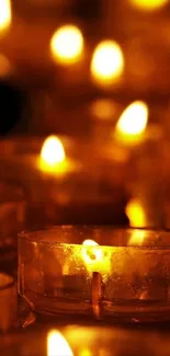 Slow burn candle flames in dark setting for warmth and tranquility.