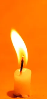 Serene mobile wallpaper featuring a glowing candle with an orange backdrop.