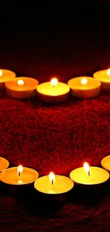 Mobile wallpaper with glowing candles on a red background.