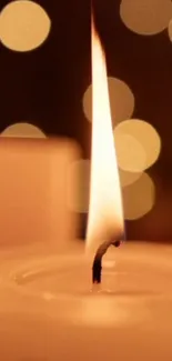 Candle flame with soft bokeh lighting background.