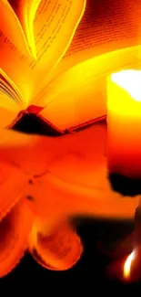 Candle illuminating an open book with orange glow.