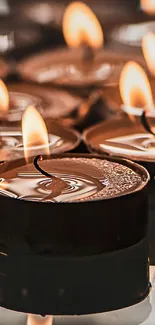 Warm candlelight wallpaper with flickering flames and soothing ambiance.