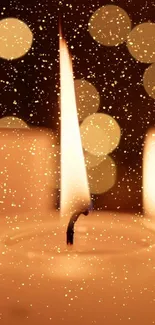 Glowing candlelight sparks on a golden background.