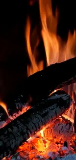 Mobile wallpaper showing a vibrant, warm fireplace with burning logs.