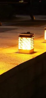 Three lanterns emit warm light on a stone platform, creating ambient outdoor lighting.