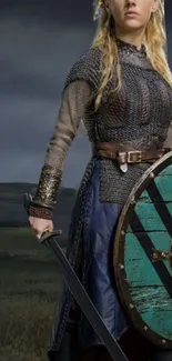 Warrior in chainmail armor holding a shield and sword.