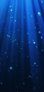 Abstract blue wallpaper with glowing light rays and particles.