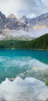 Tranquil mountain lake with clear reflection and lush forest.