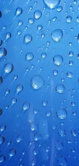 Blue water droplets on a smooth surface.