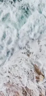 Aerial view of serene ocean waves with calming blue and white hues.