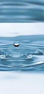 Droplet creating ripples in calm blue water wallpaper.