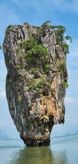 Limestone island with ocean backdrop under clear blue skies.