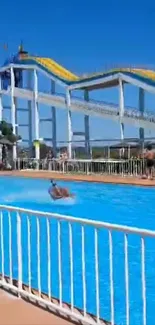 Exciting water slide at a sunny waterpark with clear blue skies.