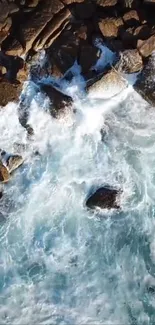 Aerial view of ocean waves crashing onto rocky coastline.