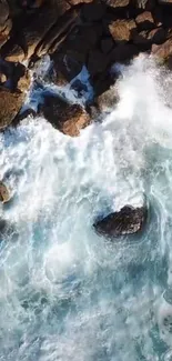 Aerial view of ocean waves crashing on rocky shore.